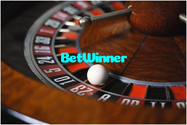 BetWinner casino presented on mobile device in Pakistan with slots and live games